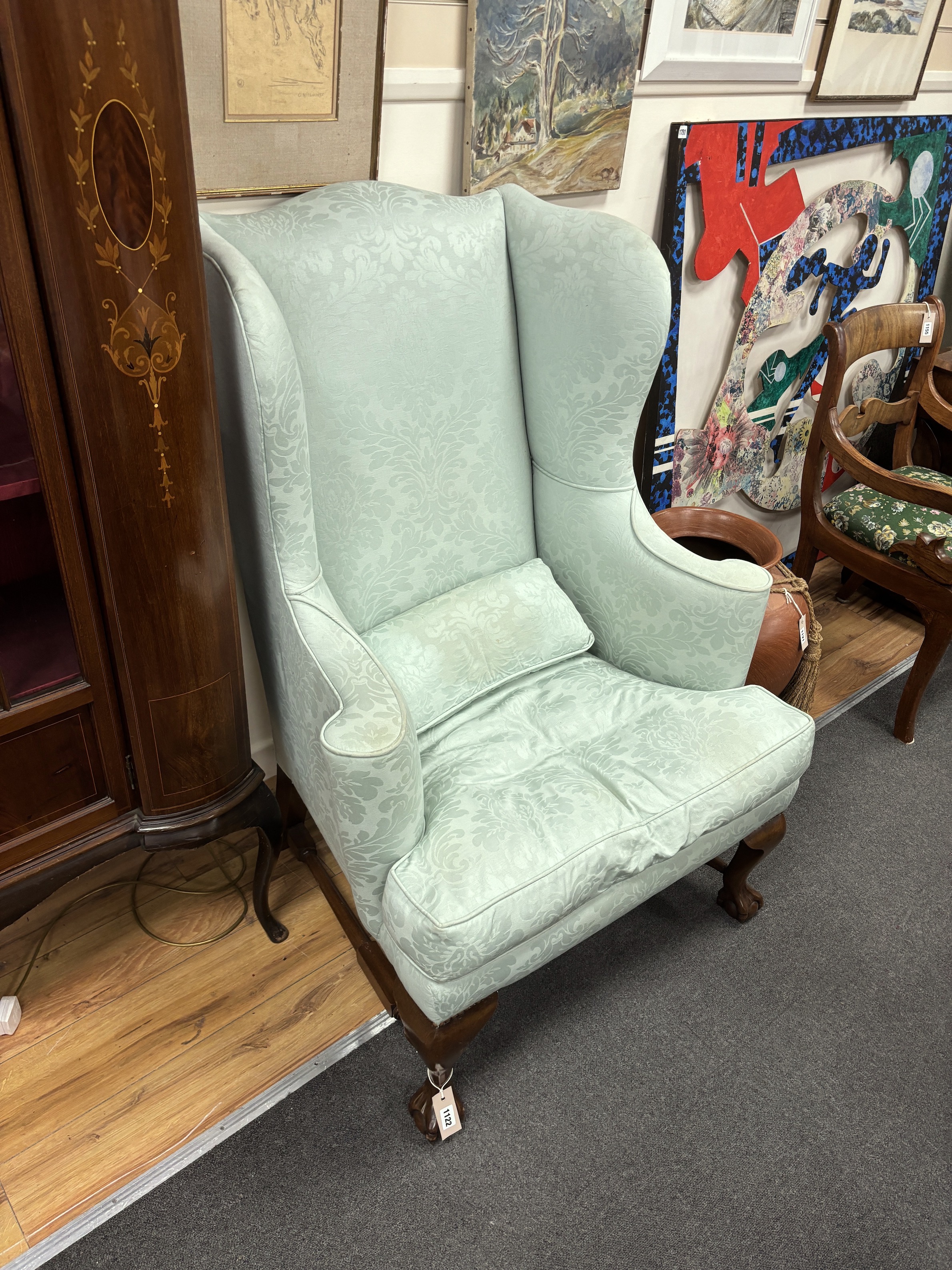 A pair of George I style upholstered wing armchairs, width 85cm, depth 86cm, height 116cm
